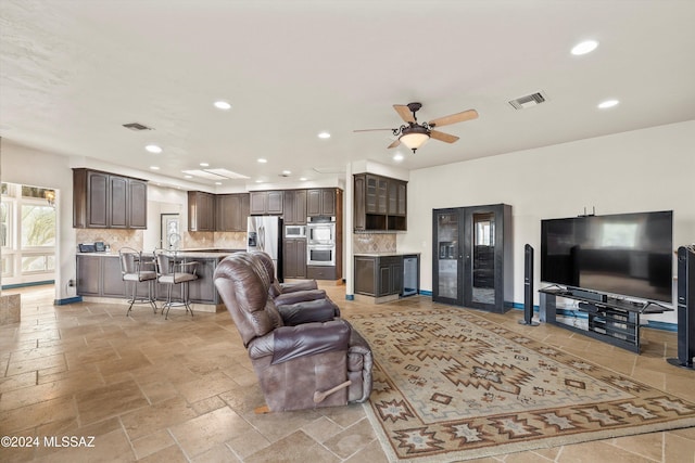 living room with wine cooler and ceiling fan