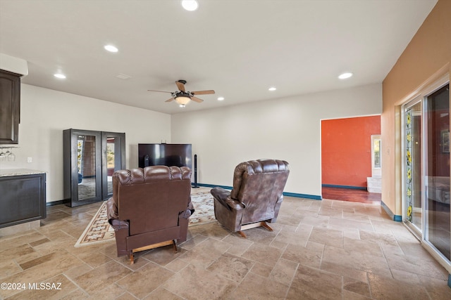 living room featuring ceiling fan