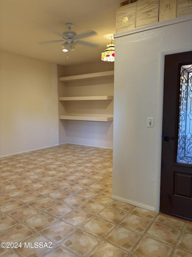 interior space featuring ceiling fan