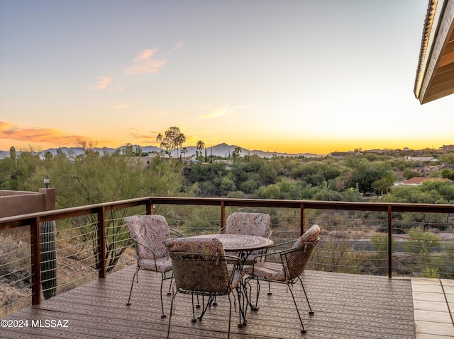 view of balcony at dusk