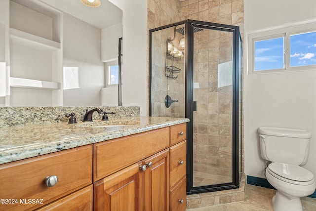 bathroom with walk in shower, tile patterned floors, vanity, and toilet