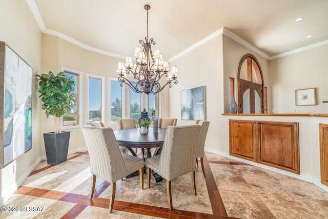 dining space with ornamental molding and an inviting chandelier