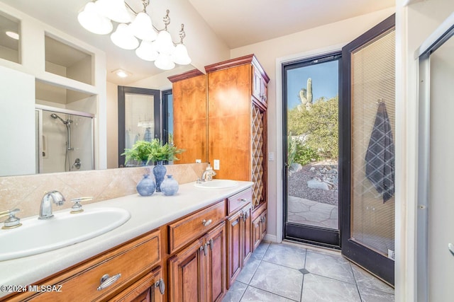 bathroom featuring lofted ceiling, tile patterned flooring, vanity, and a shower with shower door