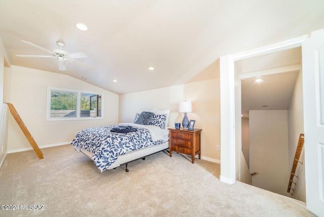 carpeted bedroom featuring ceiling fan and vaulted ceiling