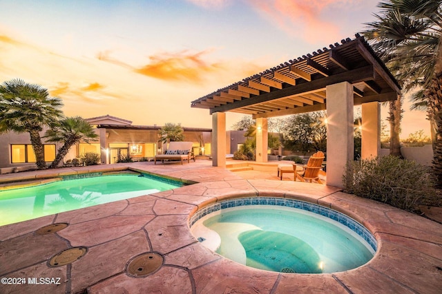 pool at dusk featuring a patio, a pergola, and an in ground hot tub