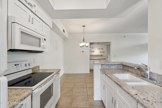 kitchen featuring white cabinets, hanging light fixtures, sink, light stone countertops, and white appliances