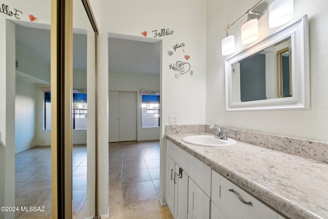 bathroom with vanity and tile patterned flooring