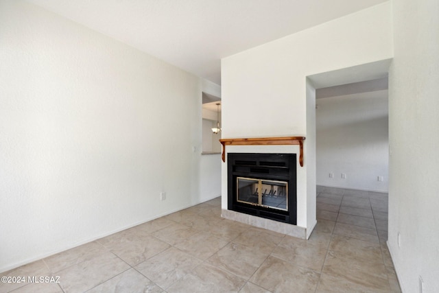 unfurnished living room featuring light tile patterned flooring