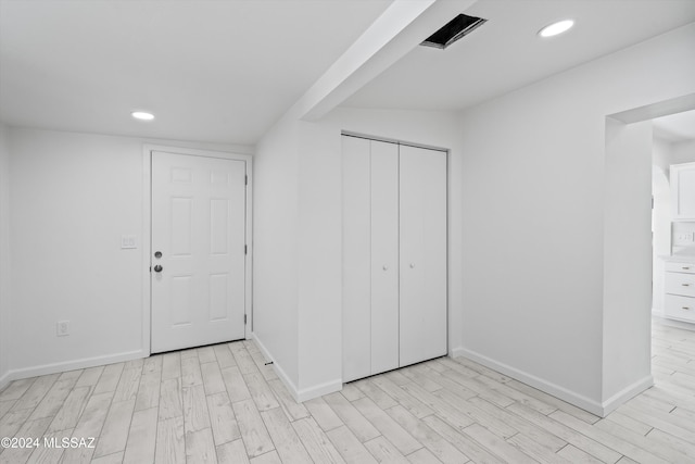 interior space with light hardwood / wood-style floors and a closet