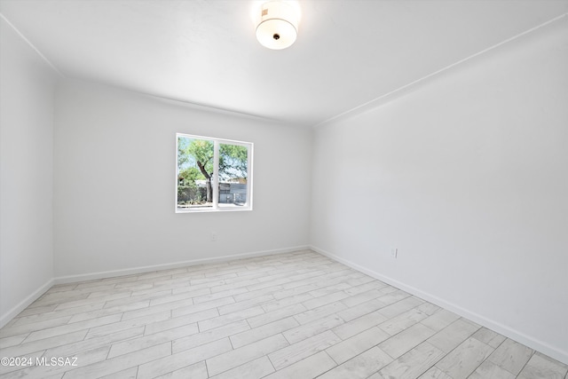 unfurnished room featuring light hardwood / wood-style flooring