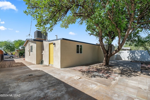 exterior space with a patio and central AC