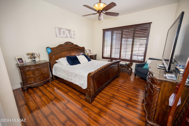 bedroom with ceiling fan and dark hardwood / wood-style flooring