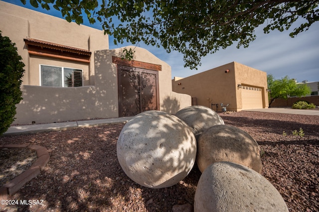 view of side of property featuring a garage