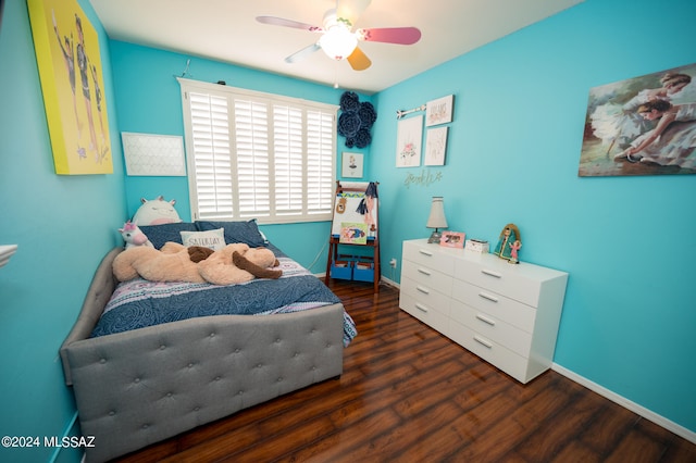 bedroom featuring ceiling fan and dark hardwood / wood-style flooring