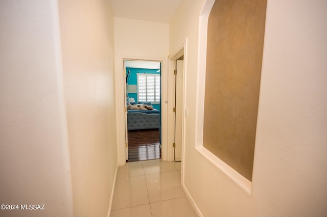 hallway featuring light tile patterned floors