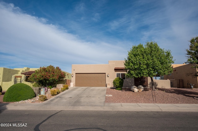 southwest-style home with a garage