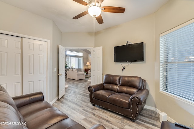 living room featuring ceiling fan and light wood-type flooring