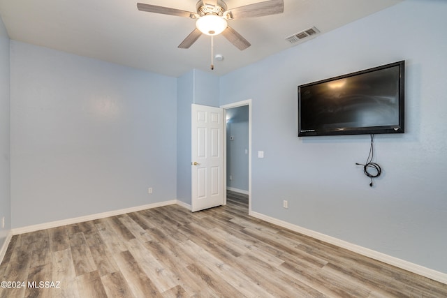 unfurnished bedroom featuring light hardwood / wood-style flooring and ceiling fan