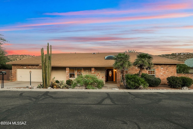 single story home with a garage