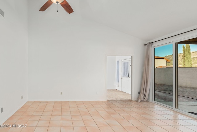 tiled spare room featuring lofted ceiling and ceiling fan