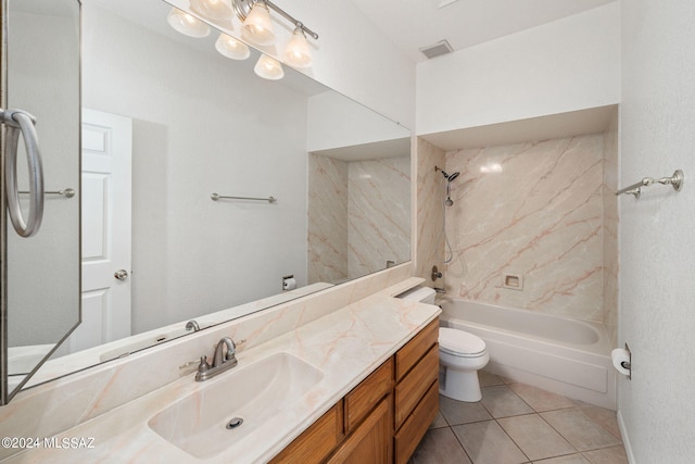 full bathroom with tiled shower / bath, vanity, tile patterned flooring, and toilet