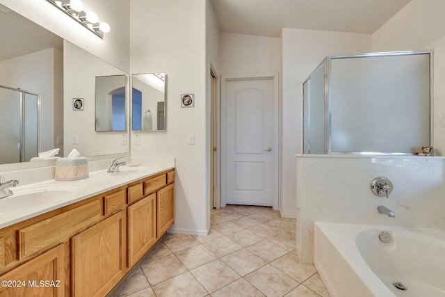 bathroom with shower with separate bathtub, tile patterned floors, and vanity