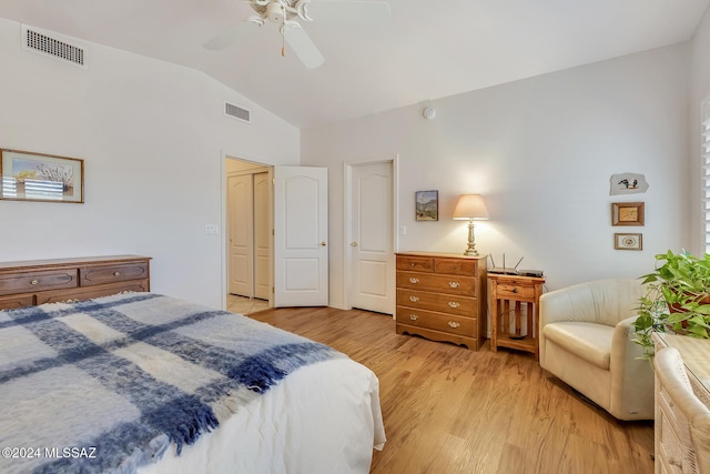 bedroom with vaulted ceiling, ceiling fan, and light hardwood / wood-style floors