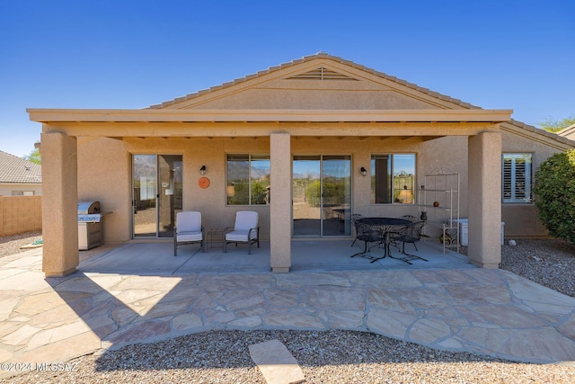 rear view of property with a patio area