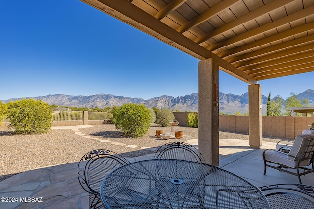 view of patio / terrace featuring a mountain view