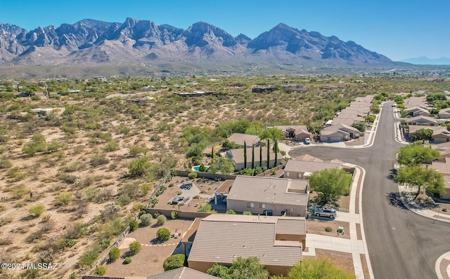 birds eye view of property with a mountain view