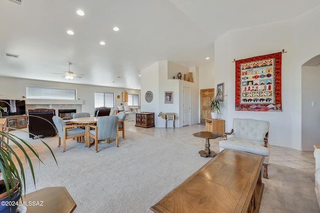 tiled living room featuring ceiling fan