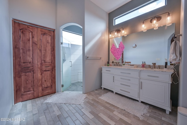 bathroom featuring vanity and an enclosed shower