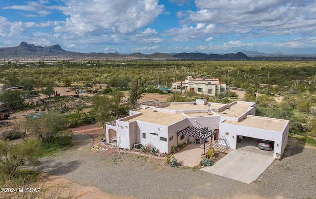 birds eye view of property featuring a mountain view