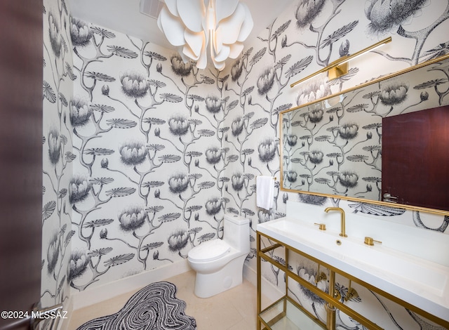 bathroom with toilet and tile patterned floors