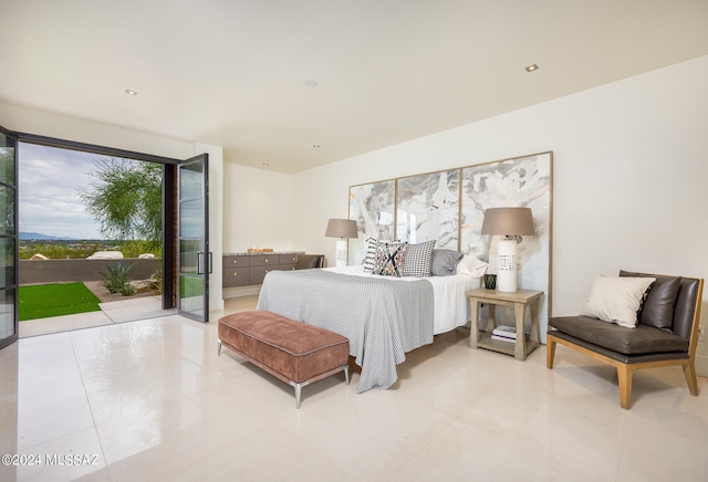 bedroom featuring access to outside and light tile patterned flooring