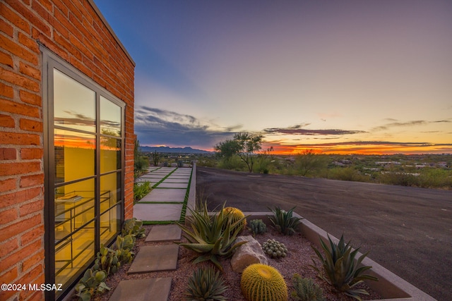 view of patio terrace at dusk