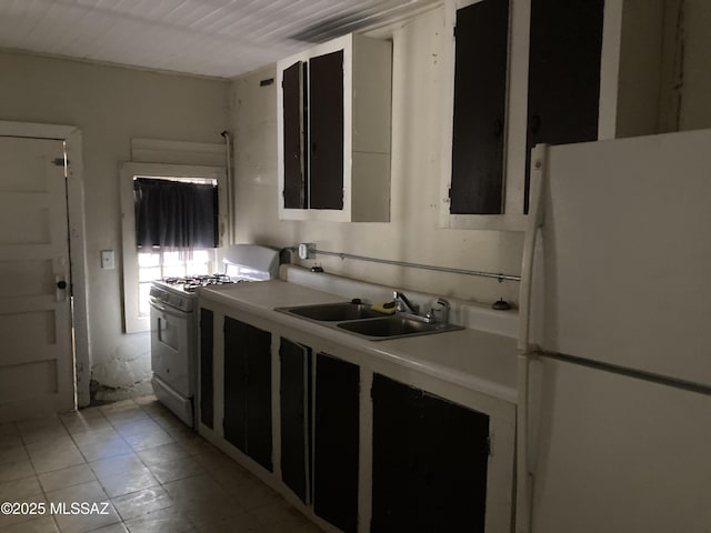 kitchen with white appliances and sink