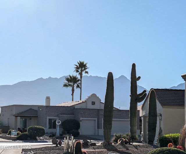 exterior space with a mountain view and a garage