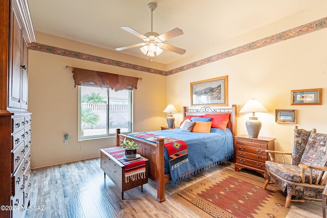 bedroom featuring ceiling fan and light hardwood / wood-style flooring