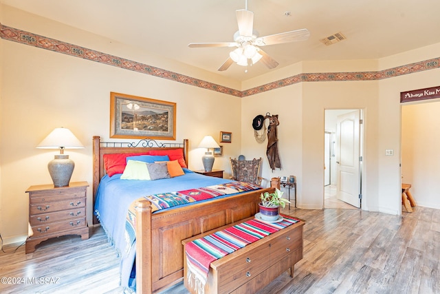 bedroom featuring ceiling fan and light hardwood / wood-style flooring