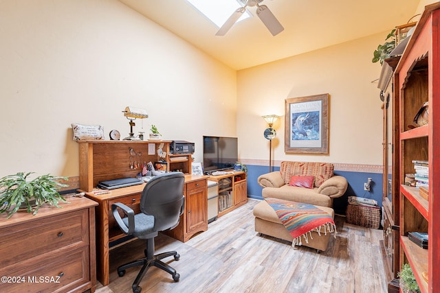 office area with lofted ceiling, light hardwood / wood-style floors, and ceiling fan