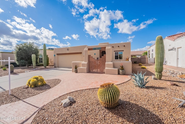 southwest-style home featuring a garage