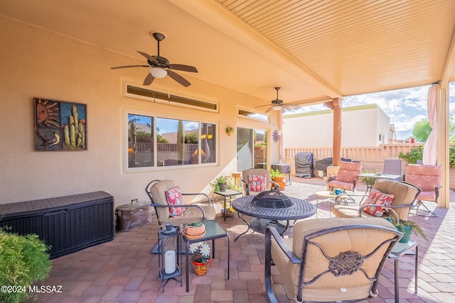 view of patio / terrace featuring ceiling fan and an outdoor living space