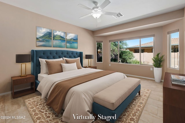 bedroom featuring ceiling fan and light tile patterned floors