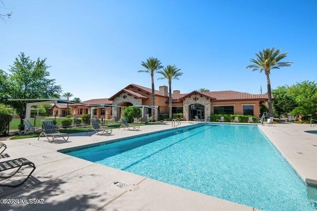 view of pool featuring a patio area