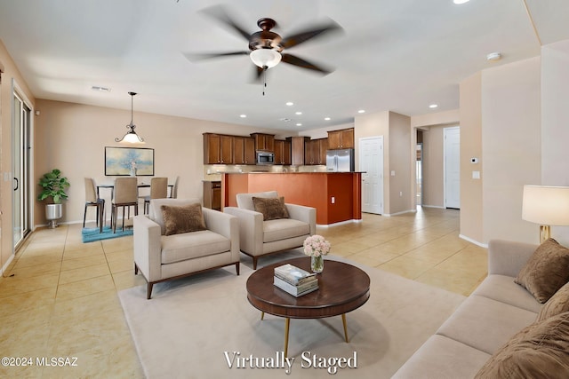 tiled living room featuring ceiling fan