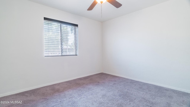 empty room featuring carpet flooring and ceiling fan