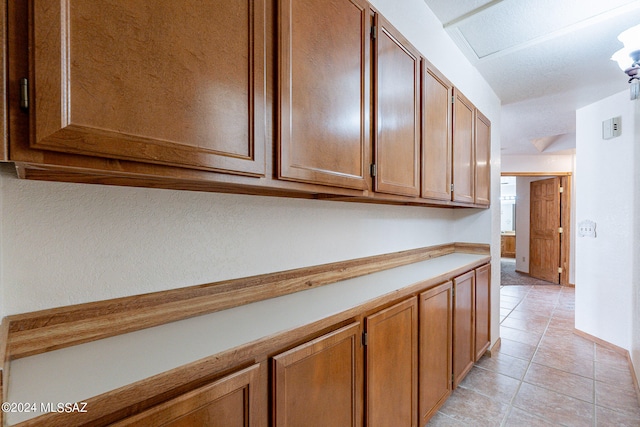 kitchen with light tile patterned floors