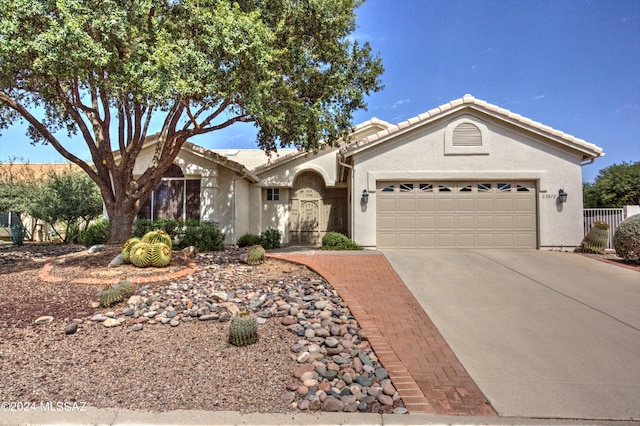 single story home featuring a garage