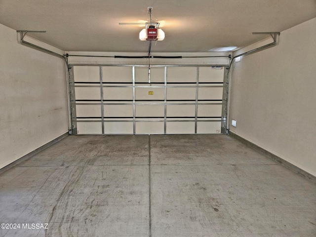 garage featuring a garage door opener